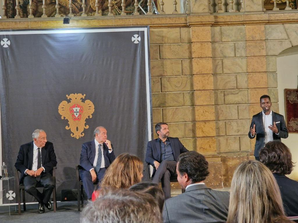 Dereck speaking at an event